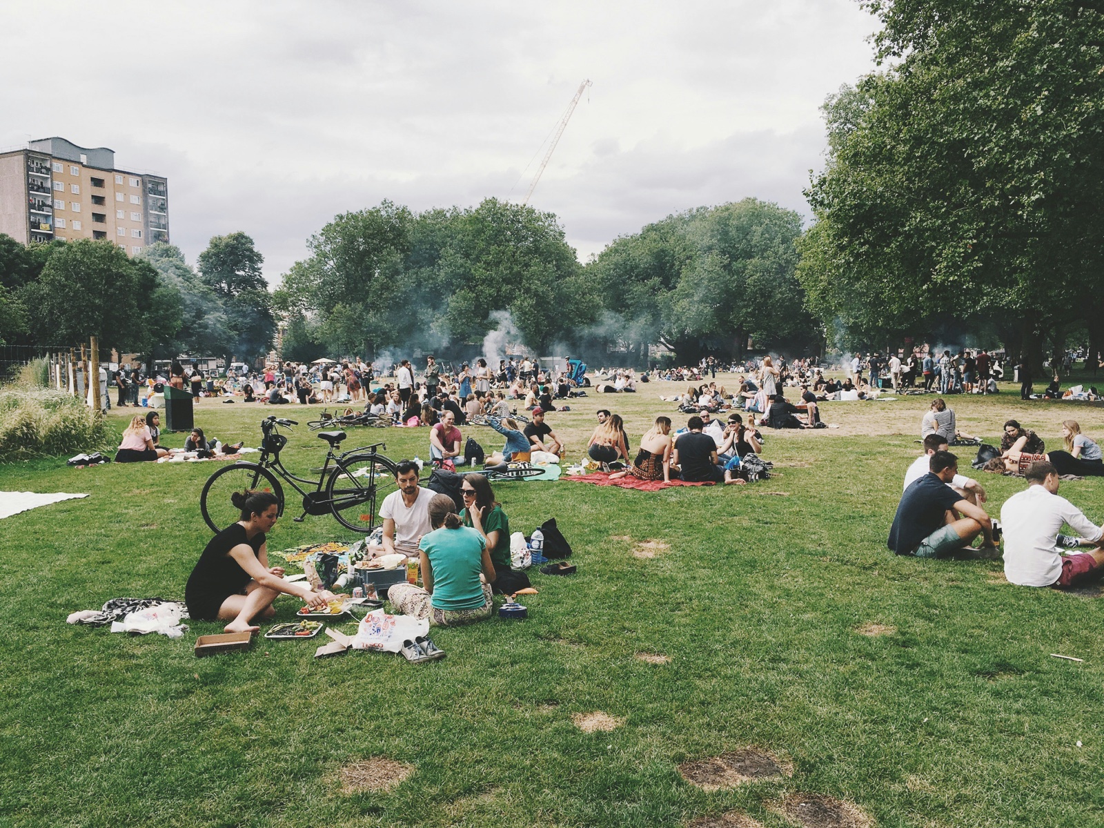 People gathered in a park on a summer afternoon